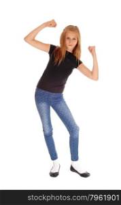 A beautiful blond girl in a black t-shirt and blue long pants dancing,isolated for white background.