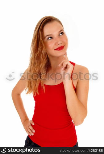 A beautiful blond young woman holding her finger on her chin, sheis wondering what she seeing, isolated for white background.