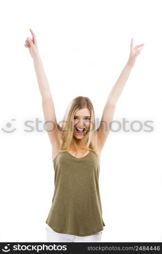 A beautiful blonde woman really happy with both arms on the air, isolated over white background