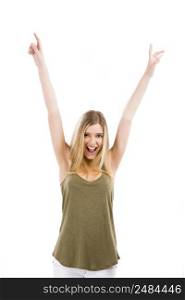 A beautiful blonde woman really happy with both arms on the air, isolated over white background