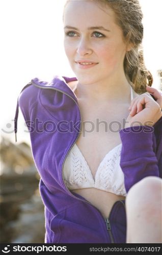 A beautiful caucasian girl outdoor on the beach during summer