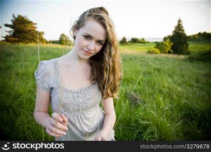 A beautiful caucasian teenage girl outdoor in summer