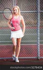 A beautiful caucasian tennis player on the tennis court