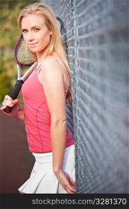 A beautiful caucasian tennis player on the tennis court
