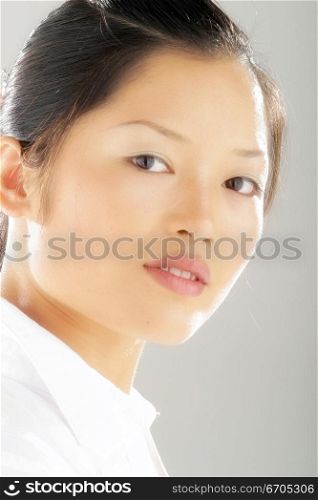 A beautiful Chinese model posing in the studio.