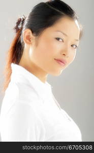 A beautiful Chinese model posing in the studio.