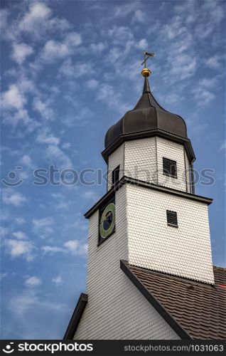 A beautiful clock tower, traditional in Germany. Vertical view