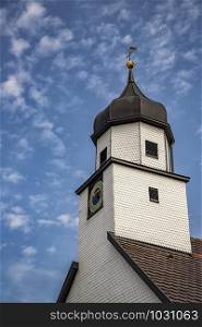 A beautiful clock tower, traditional in Germany. Vertical view