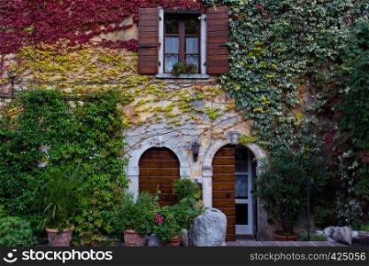 a beautiful facade of an ancient house in a small town Tremosine. Italy.
