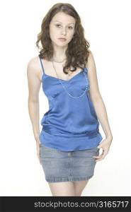 A beautiful female woman in a blue top and denim skirt