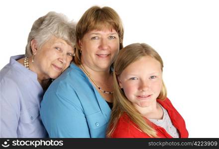 A beautiful grandmother, mother, and little girl with a very strong family resemblance. Isolated on white.