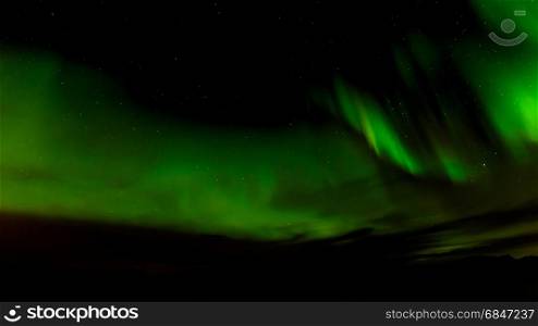A beautiful green Aurora borealis or northern lights, Norway