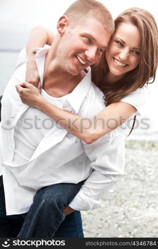 A beautiful happy caucasian couple in love on the beach