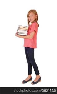 A beautiful little girl in a pink sweater and blond curly hair caring herbooks, isolated for white background.