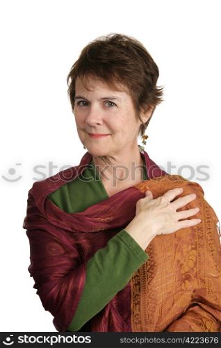 A beautiful, mature Irish woman wearing a colorful shawl. Isolated on white.