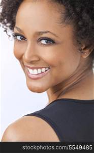 A beautiful mixed race African American girl or young woman looking happy and smiling with perfect teeth