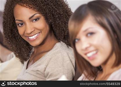 A beautiful mixed race African American girl smiling with her Chinese Asian friend