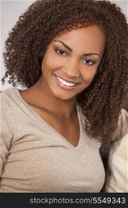 A beautiful mixed race African American girl with perfect teeth and smile
