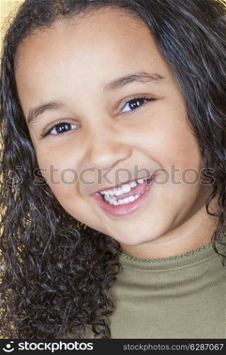 A beautiful mixed race African American little girl female child looking happy and laughing