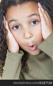 A beautiful mixed race African American little girl female child looking surprised or shocked