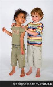 A beautiful mixed race girl and a blonde boy stand together laughing