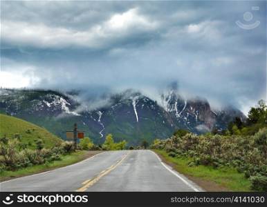 A Beautiful Mountain Landscape With Dramatic Sky And Road