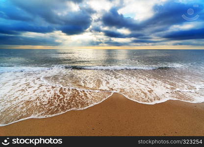 a beautiful sandy beach at sunrise