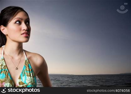 A beautiful sexy asian woman in bikini on the beach