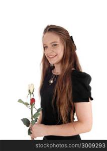 A beautiful smiling young woman in a black dress standing isolatedfor white background, smiling, holding two roses
