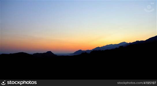 A beautiful sunset over Plakias bay and the surrounding mountains in Crete, Greece. Oodles of copyspace