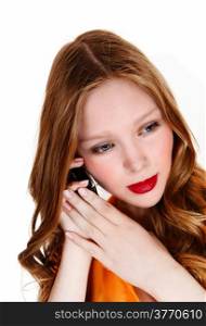 A beautiful teenager girl holding a cell phone on her ear, with longblond hair, isolated for white background.