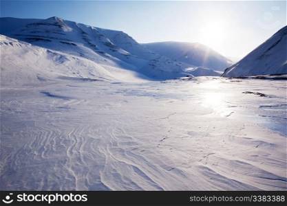 A beautiful winter moutain snow landscape taken on Spitsbergen Island, Svalbard, Norway