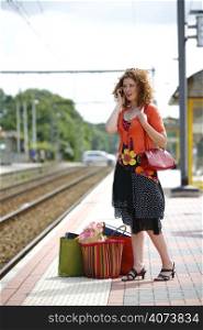 A beautiful woman at a train station