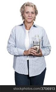 A beautiful woman holding her retirement account of coins in a milk bottle