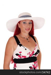 A beautiful woman in a dress, wearing a whitehat, in a portrait image, isolated for white background.