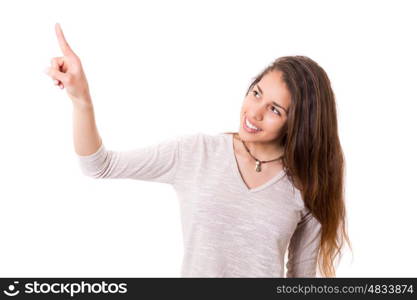 A beautiful woman pointing to something, isolated over a copy space background