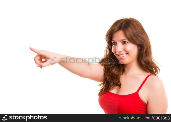 A beautiful woman pointing to something, isolated over a copy space background