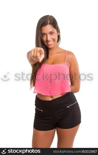 A beautiful woman pointing to something, isolated over a copy space background