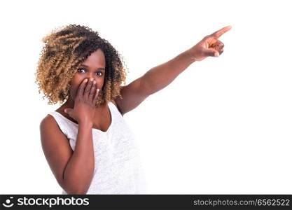 A beautiful woman pointing to something, isolated over a white background