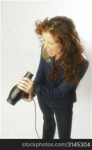 A beautiful woman poses with hair dryer