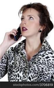 A beautiful woman talking on a cell phone