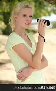 A beautiful woman with binoculars.
