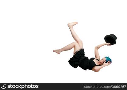 A beautiful young actress dancer wearing a top hat flying through the sky or falling through the air