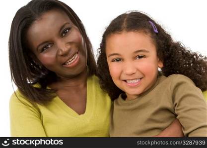 A beautiful young African American mother and her mixed race young daughter having fun