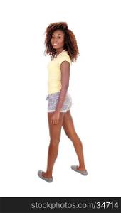 A beautiful young African American woman in shorts standing in full length in shorts, isolated for white background.