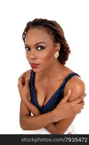 A beautiful young African American woman with braided brown hair,her arms around her shoulder, isolated for white background.