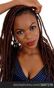 A beautiful young African American woman with long braided brown hair,with one hand on her head, isolated for white background.