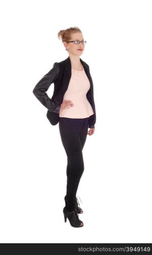 A beautiful young business woman standing in black tights and jacketwith glasses isolated for white background.