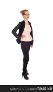 A beautiful young business woman standing in black tights and jacketwith glasses isolated for white background.