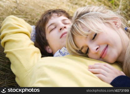 A beautiful young caucasian couple in love relaxing